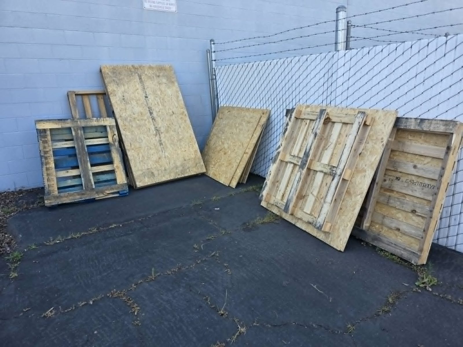 Clean Slate Hauling and Removal stacked plywood for removal