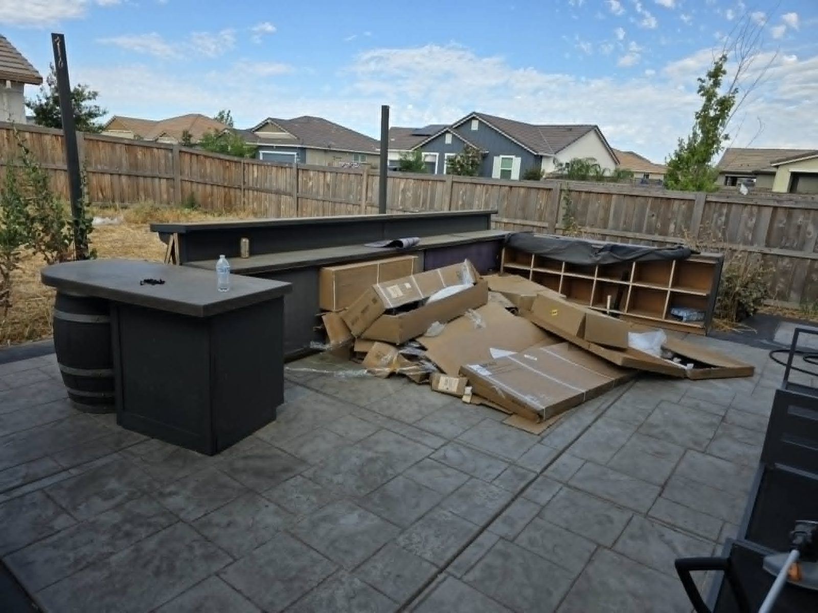 Clean Slate Hauling and Removal cardboard on patio before cleanup