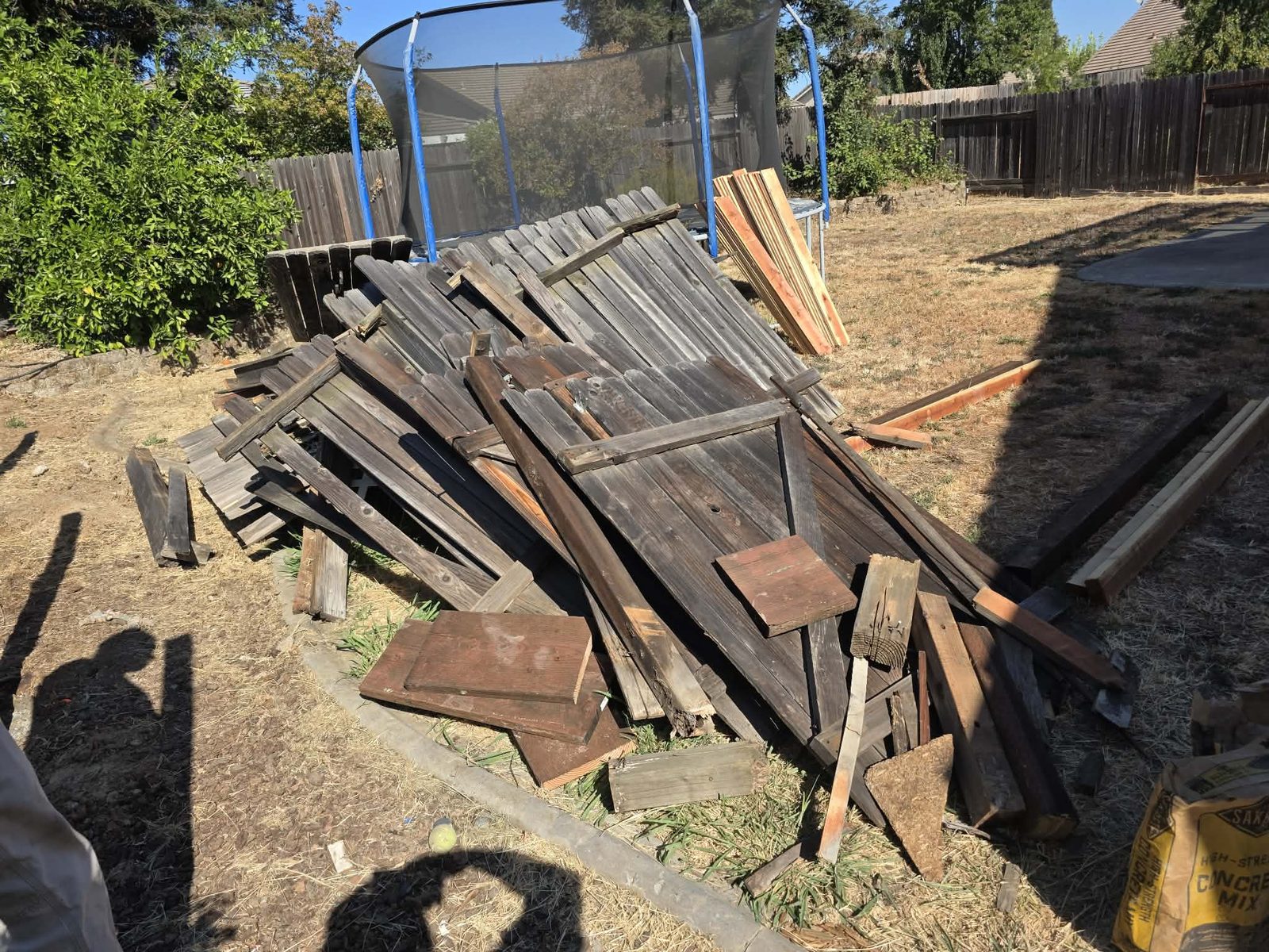 Clean Slate Hauling and Removal wood pile in backyard before removal